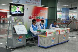 170,000 volunteers 'man' the stands in the streets, stations and tourist sites as well as helping at the Expo 170,000 volunteers 'man' the stands in the streets, stations and tourist sites as well as helping at the Expo